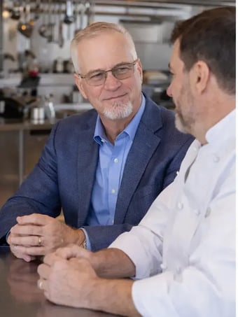 Jim Pate consulting with a restaurant owner in Sacramento California